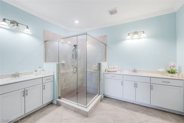 bathroom featuring tile patterned flooring, vanity, and crown molding