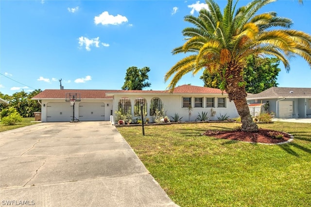 ranch-style home with a garage and a front yard