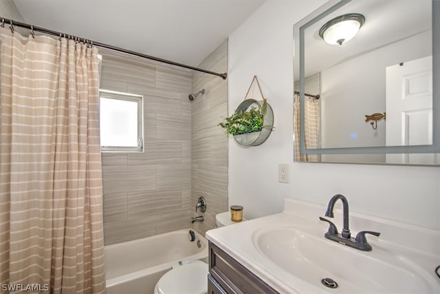 full bathroom featuring vanity, shower / bath combo, and toilet