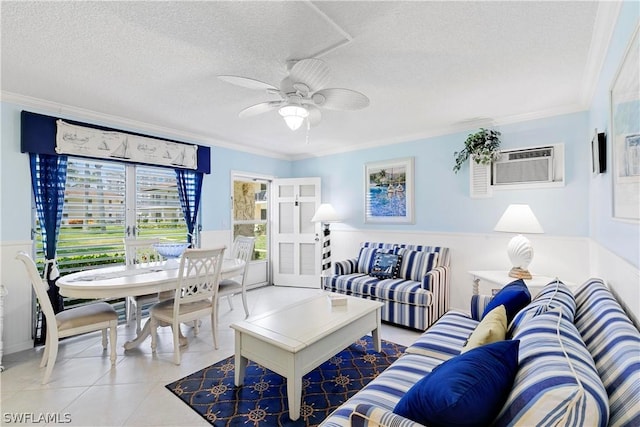 tiled living room featuring a textured ceiling, ceiling fan, an AC wall unit, and crown molding