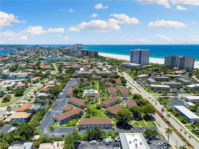 bird's eye view featuring a beach view and a water view