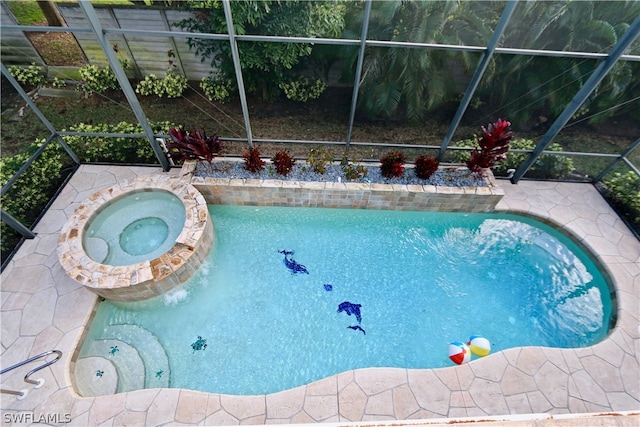 view of swimming pool with a lanai and an in ground hot tub