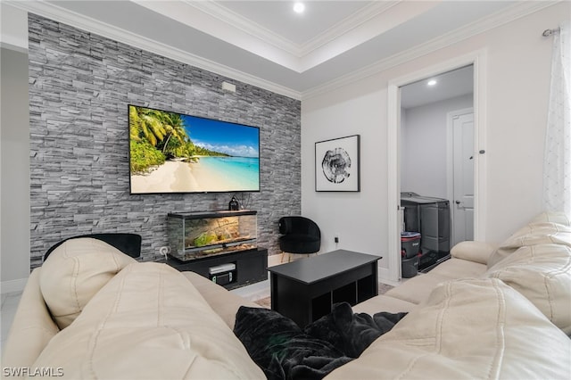 living room with washing machine and dryer and crown molding