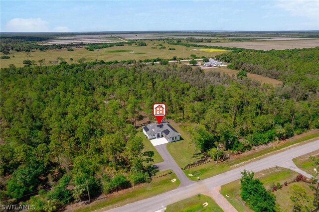 birds eye view of property with a rural view