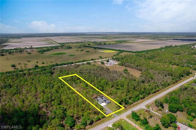 birds eye view of property featuring a rural view