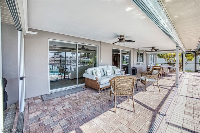 view of patio / terrace with an outdoor living space and ceiling fan