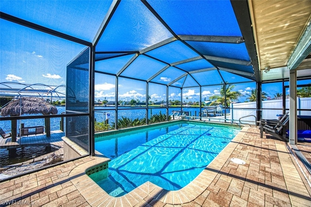 view of swimming pool with a boat dock, a water view, a patio area, and a lanai