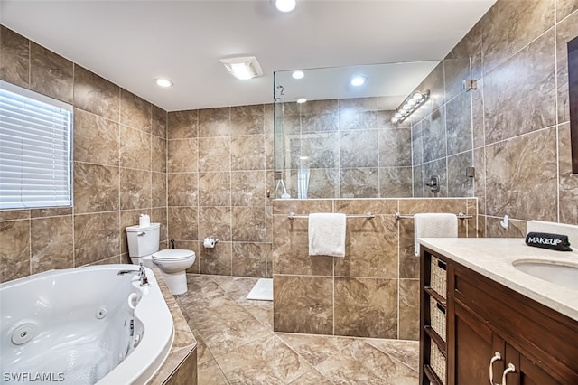 full bathroom featuring shower with separate bathtub, vanity, tile walls, and toilet