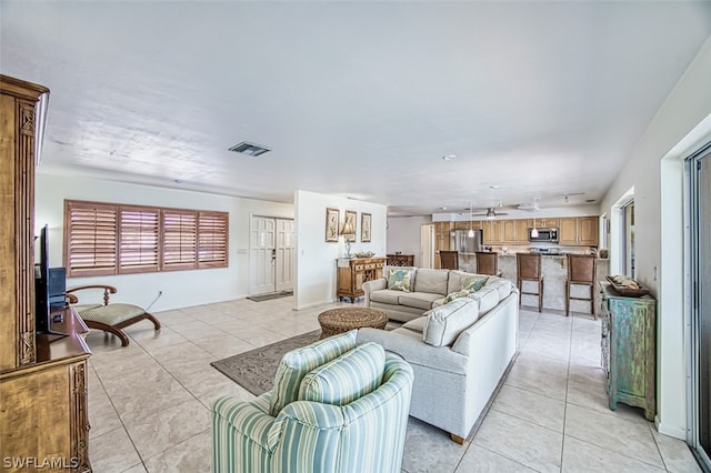 living room with light tile patterned floors