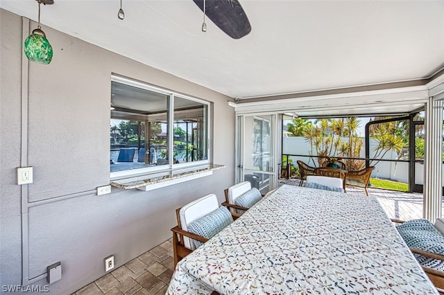 bedroom featuring ceiling fan and multiple windows