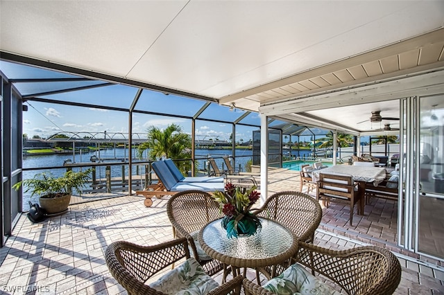 sunroom / solarium with a water view