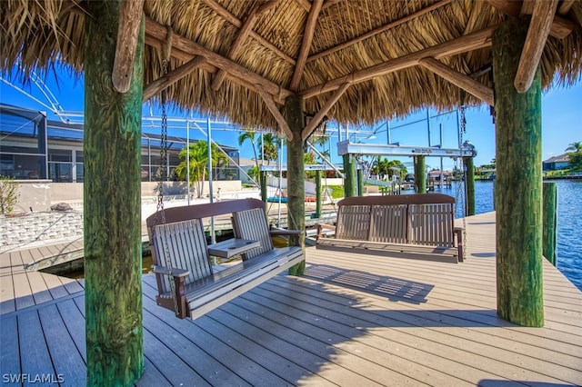 dock area featuring a lanai and a water view