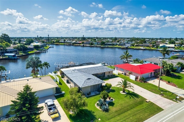 birds eye view of property with a water view