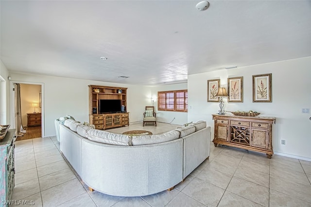 living room with light tile patterned flooring