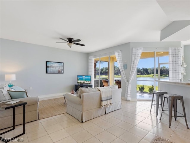 living room with light tile patterned floors and ceiling fan