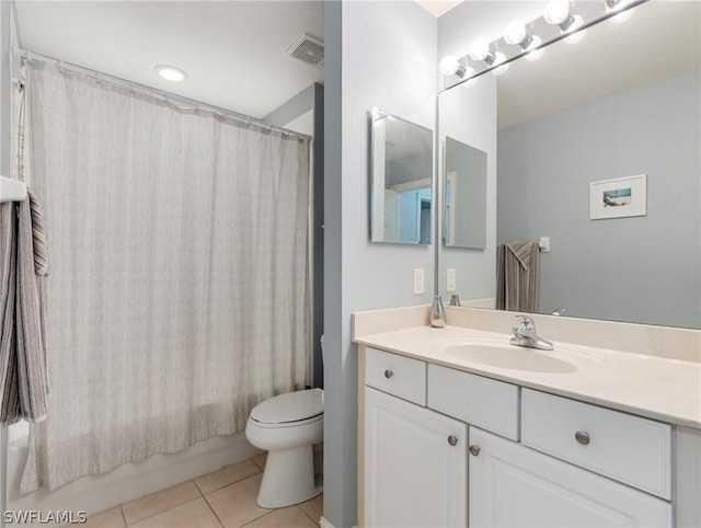 full bathroom with tile patterned flooring, shower / bath combo, vanity, and toilet