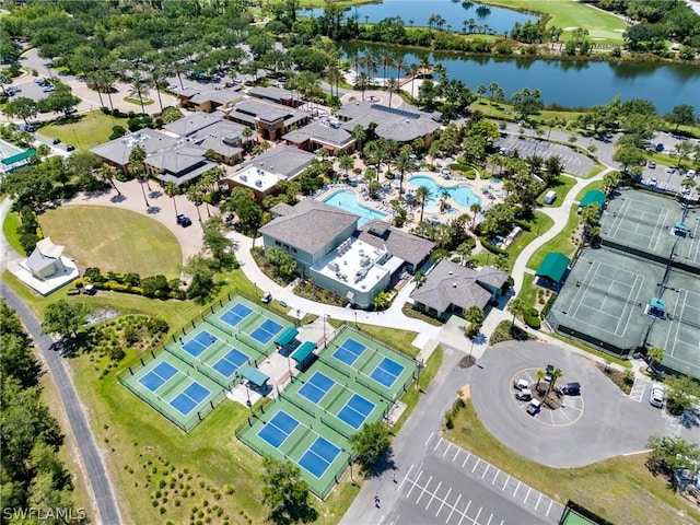 birds eye view of property with a water view