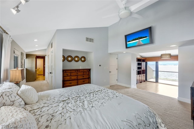 carpeted bedroom featuring ceiling fan and lofted ceiling