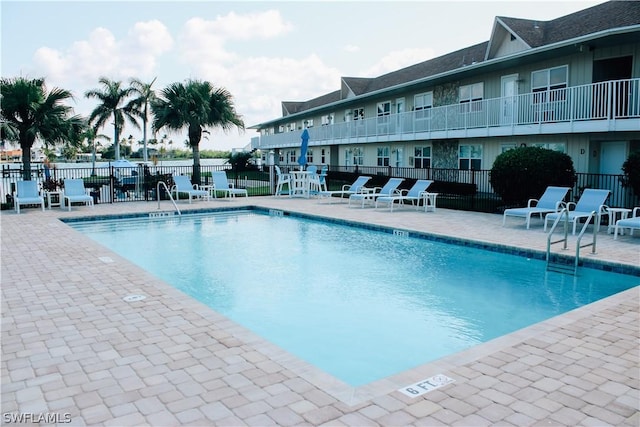 view of swimming pool with a patio