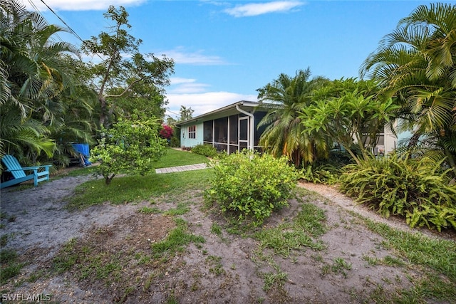 view of yard with a sunroom