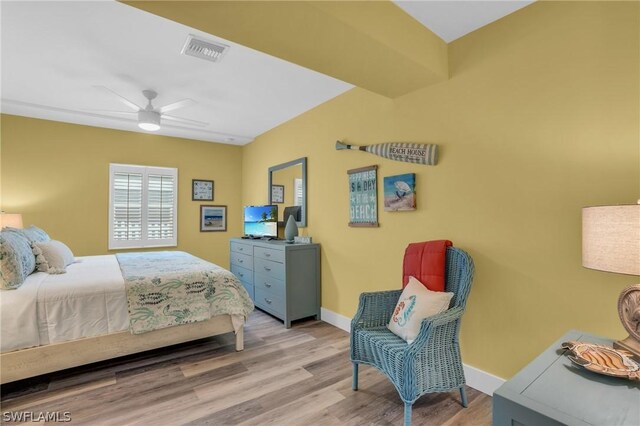 bedroom with ceiling fan and light wood-type flooring