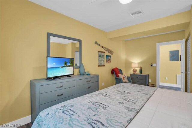 bedroom featuring electric panel