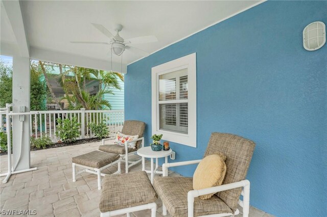 view of patio featuring ceiling fan