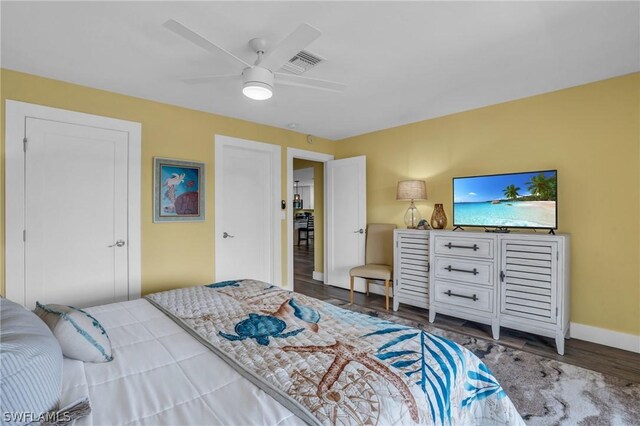 bedroom with wood-type flooring and ceiling fan