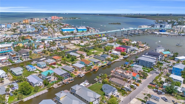 birds eye view of property featuring a water view