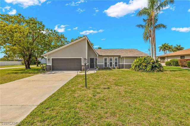 ranch-style house featuring a garage and a front lawn