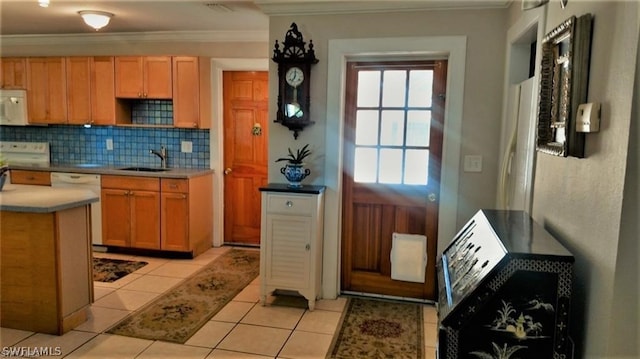 kitchen featuring sink, tasteful backsplash, crown molding, white appliances, and light tile patterned flooring