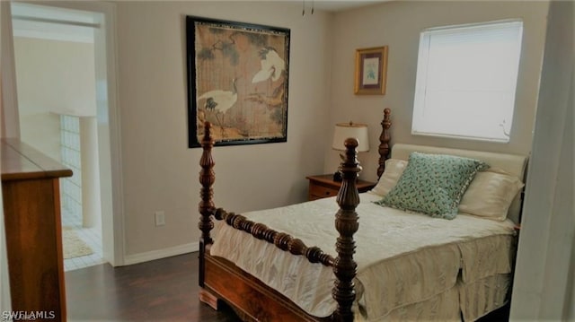 bedroom featuring dark hardwood / wood-style flooring