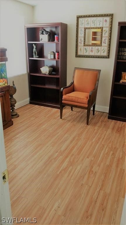 sitting room with light hardwood / wood-style floors