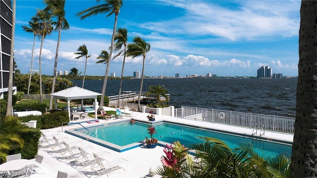 view of pool featuring a gazebo, a water view, and a patio