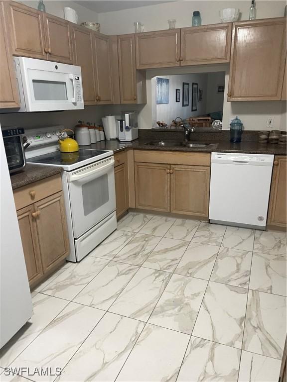 kitchen with white appliances and sink