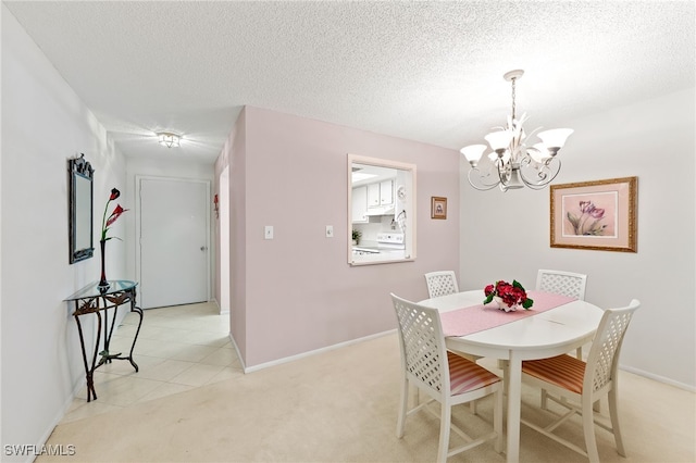 dining space with light colored carpet, a textured ceiling, and a chandelier