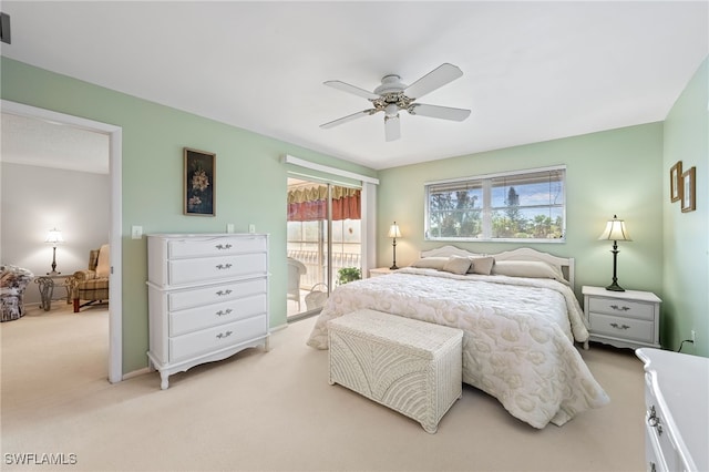 carpeted bedroom featuring ceiling fan and access to outside