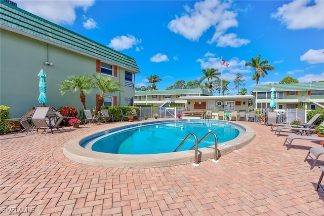 view of swimming pool with a patio area