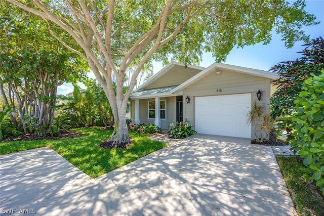 view of front facade with a garage and a front lawn