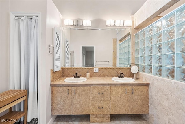 bathroom with vanity and decorative backsplash