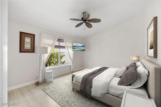 bedroom with ceiling fan and light hardwood / wood-style floors