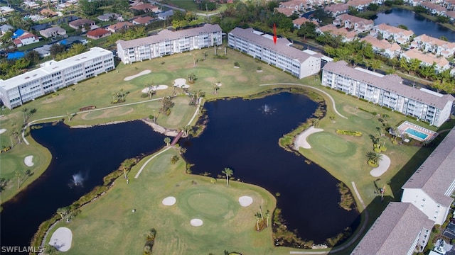 aerial view featuring view of golf course and a water view