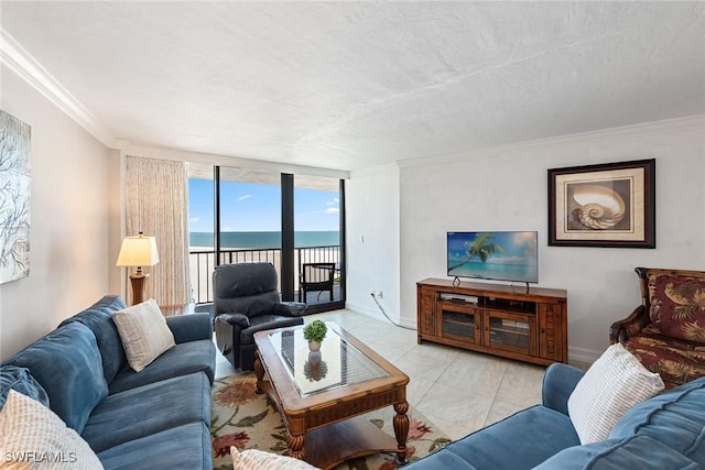 tiled living area featuring a textured ceiling, crown molding, baseboards, and expansive windows