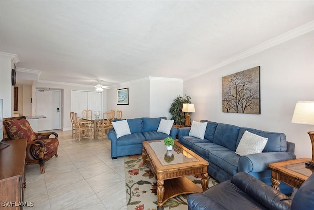 living area featuring light tile patterned floors, ornamental molding, and a ceiling fan