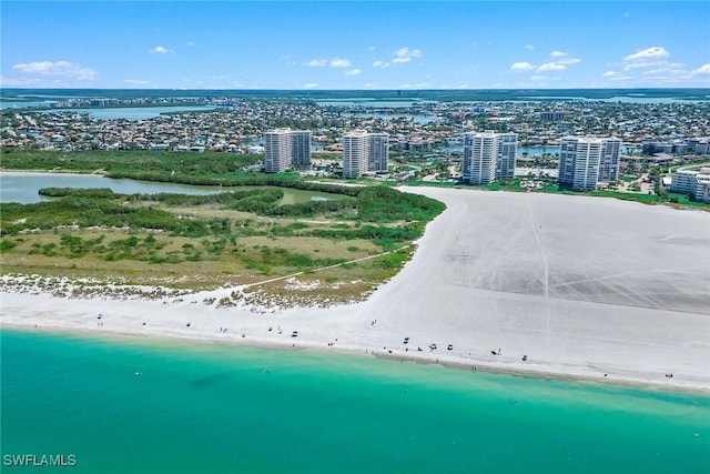 birds eye view of property with a city view, a beach view, and a water view