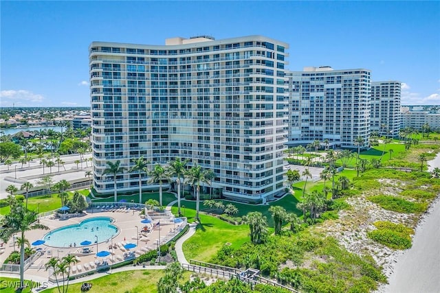 view of building exterior featuring a view of city and a water view