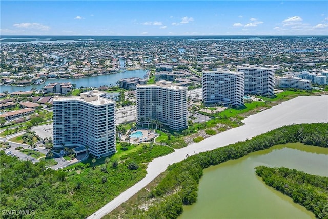 drone / aerial view featuring a water view and a city view