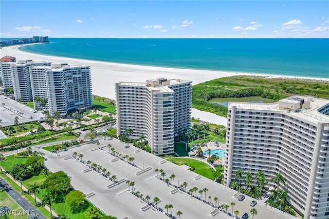 aerial view with a water view, a city view, and a view of the beach