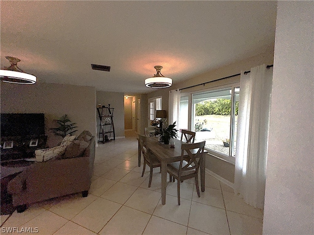 dining area featuring light tile patterned floors