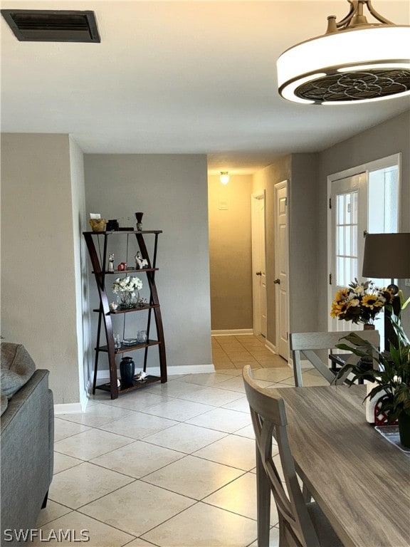 dining area featuring light tile patterned floors